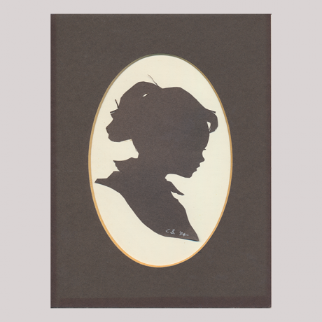 
        Front of silhouette, with girl in frame looking right.